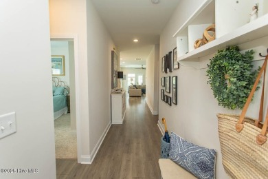 Upgrades galore in this beautiful 4BR/2BA home in the quaint on Ocean Ridge Plantation in North Carolina - for sale on GolfHomes.com, golf home, golf lot