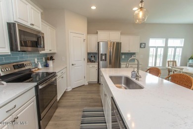 Upgrades galore in this beautiful 4BR/2BA home in the quaint on Ocean Ridge Plantation in North Carolina - for sale on GolfHomes.com, golf home, golf lot