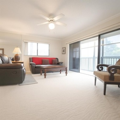 Spacious, sunlit 2-bed, 2-bath corner condo in the sought-after on Flamingo Lakes Country Club in Florida - for sale on GolfHomes.com, golf home, golf lot