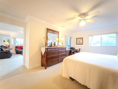 Spacious, sunlit 2-bed, 2-bath corner condo in the sought-after on Flamingo Lakes Country Club in Florida - for sale on GolfHomes.com, golf home, golf lot
