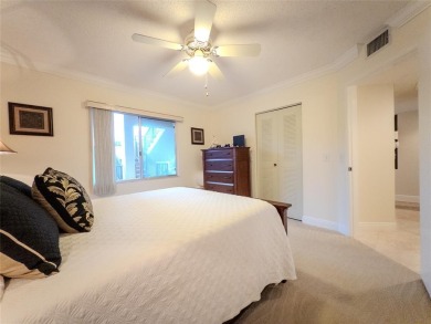 Spacious, sunlit 2-bed, 2-bath corner condo in the sought-after on Flamingo Lakes Country Club in Florida - for sale on GolfHomes.com, golf home, golf lot