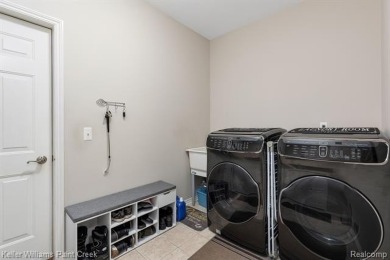 Welcome to 5504 Eagleview Court! This end-unit ranch condo is on Pine Knob Golf Club - Hawk in Michigan - for sale on GolfHomes.com, golf home, golf lot