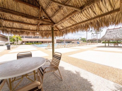 Spacious, sunlit 2-bed, 2-bath corner condo in the sought-after on Flamingo Lakes Country Club in Florida - for sale on GolfHomes.com, golf home, golf lot