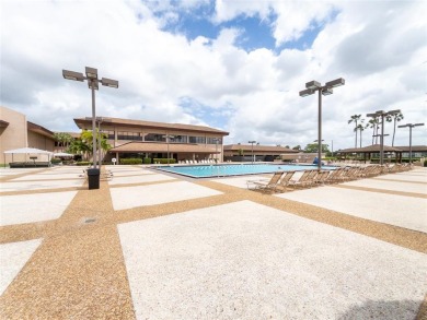 Spacious, sunlit 2-bed, 2-bath corner condo in the sought-after on Flamingo Lakes Country Club in Florida - for sale on GolfHomes.com, golf home, golf lot