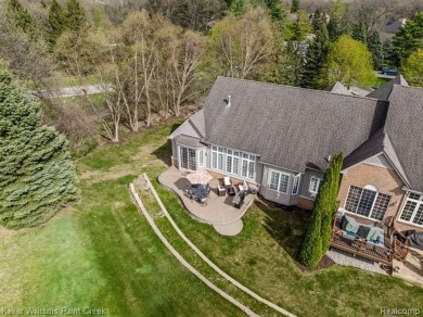 Welcome to 5504 Eagleview Court! This end-unit ranch condo is on Pine Knob Golf Club - Hawk in Michigan - for sale on GolfHomes.com, golf home, golf lot