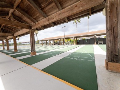 Spacious, sunlit 2-bed, 2-bath corner condo in the sought-after on Flamingo Lakes Country Club in Florida - for sale on GolfHomes.com, golf home, golf lot