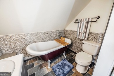 This updated 4-bedroom, 3-bath home is tucked into the Bent Tree on Bent Tree Golf Course in Georgia - for sale on GolfHomes.com, golf home, golf lot