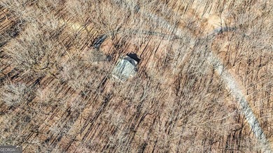 This updated 4-bedroom, 3-bath home is tucked into the Bent Tree on Bent Tree Golf Course in Georgia - for sale on GolfHomes.com, golf home, golf lot