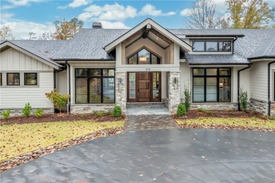 This newly constructed waterfront retreat, located in The on The Cliffs At Keowee Springs in South Carolina - for sale on GolfHomes.com, golf home, golf lot