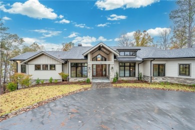 This newly constructed waterfront retreat, located in The on The Cliffs At Keowee Springs in South Carolina - for sale on GolfHomes.com, golf home, golf lot