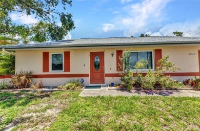 NO HOA - FENCED YARD - MINUTES TO CHARLOTTE HARBOR! This on Port Charlotte Golf Club in Florida - for sale on GolfHomes.com, golf home, golf lot