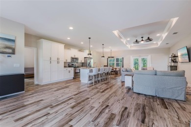 Experience the Best of Country Elegance and Modern Living in on Seminole Lakes Country Club in Florida - for sale on GolfHomes.com, golf home, golf lot