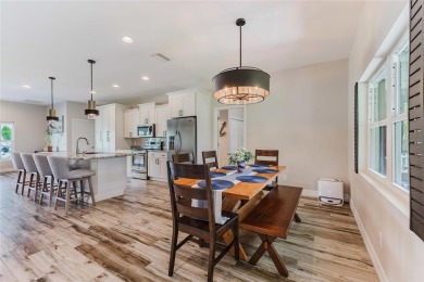 Experience the Best of Country Elegance and Modern Living in on Seminole Lakes Country Club in Florida - for sale on GolfHomes.com, golf home, golf lot