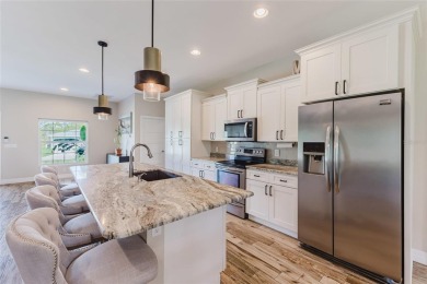 Experience the Best of Country Elegance and Modern Living in on Seminole Lakes Country Club in Florida - for sale on GolfHomes.com, golf home, golf lot