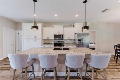 Experience the Best of Country Elegance and Modern Living in on Seminole Lakes Country Club in Florida - for sale on GolfHomes.com, golf home, golf lot