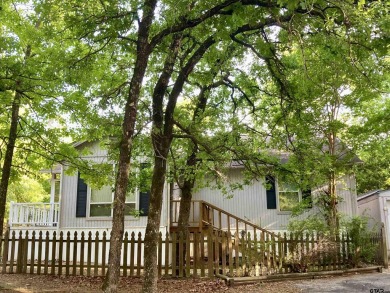 Priced below Wood CAD appraised value shows MOTIVATED seller who on Holly Lake Ranch Golf Club in Texas - for sale on GolfHomes.com, golf home, golf lot