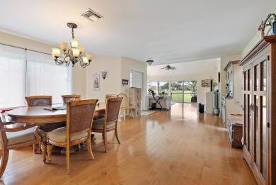 In the heart of Palm Beach Gardens this beautifully updated on Old Marsh Golf Club in Florida - for sale on GolfHomes.com, golf home, golf lot