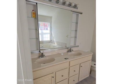 Located in the Country Club of the Poconos, 1712 Big Ridge Drive on Country Club of the Poconos Golf Course in Pennsylvania - for sale on GolfHomes.com, golf home, golf lot