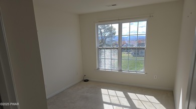 Located in the Country Club of the Poconos, 1712 Big Ridge Drive on Country Club of the Poconos Golf Course in Pennsylvania - for sale on GolfHomes.com, golf home, golf lot