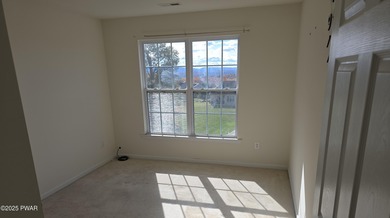 Located in the Country Club of the Poconos, 1712 Big Ridge Drive on Country Club of the Poconos Golf Course in Pennsylvania - for sale on GolfHomes.com, golf home, golf lot