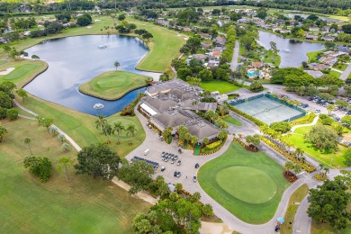 In the heart of Palm Beach Gardens this beautifully updated on Old Marsh Golf Club in Florida - for sale on GolfHomes.com, golf home, golf lot