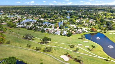 In the heart of Palm Beach Gardens this beautifully updated on Old Marsh Golf Club in Florida - for sale on GolfHomes.com, golf home, golf lot