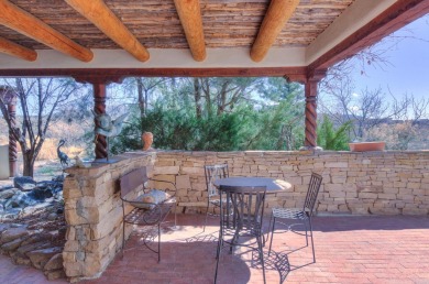 Enjoy indoor and outdoor living spaces as you take in on Taos Country Club in New Mexico - for sale on GolfHomes.com, golf home, golf lot