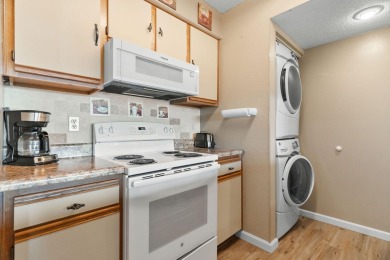 In the heart of Pointe Royale, you'll find this homey condo on Pointe Royale Village Country Club in Missouri - for sale on GolfHomes.com, golf home, golf lot