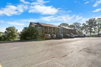 In the heart of Pointe Royale, you'll find this homey condo on Pointe Royale Village Country Club in Missouri - for sale on GolfHomes.com, golf home, golf lot