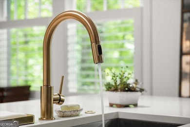 Built in 2019, this meticulously maintained 2-bedroom, 2.5-bath on Candler Park Golf Course in Georgia - for sale on GolfHomes.com, golf home, golf lot