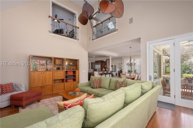 As you step inside, you're greeted by an open and airy floor on The Golf Club at Indigo Run in South Carolina - for sale on GolfHomes.com, golf home, golf lot