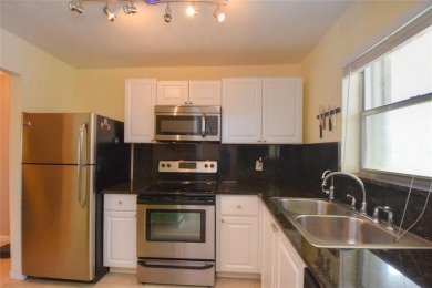 Rarely available, *investor friendly*, light & bright 2 bedroom on Crystal Lake Country Club in Florida - for sale on GolfHomes.com, golf home, golf lot