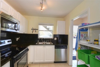 Rarely available, *investor friendly*, light & bright 2 bedroom on Crystal Lake Country Club in Florida - for sale on GolfHomes.com, golf home, golf lot