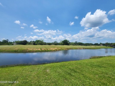 Expansive open views of Lions Paw #13 fairway and pond from this on Ocean Ridge Plantation in North Carolina - for sale on GolfHomes.com, golf home, golf lot