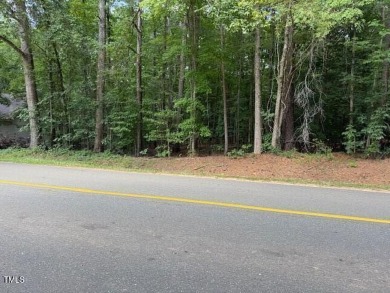 Private & wooded building lot located within a gated community on River Golf and County Club at Lake Royale in North Carolina - for sale on GolfHomes.com, golf home, golf lot