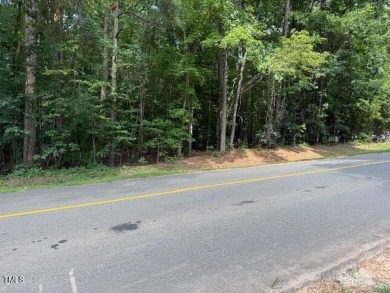 Private & wooded building lot located within a gated community on River Golf and County Club at Lake Royale in North Carolina - for sale on GolfHomes.com, golf home, golf lot