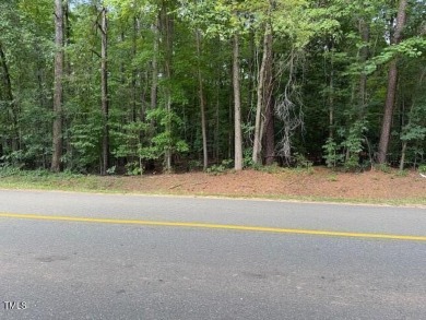 Private & wooded building lot located within a gated community on River Golf and County Club at Lake Royale in North Carolina - for sale on GolfHomes.com, golf home, golf lot