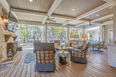 Nestled among mature trees and overlooking Wynlakes Golf Course on Wynlakes Golf and Country Club in Alabama - for sale on GolfHomes.com, golf home, golf lot