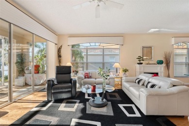 Welcome to this charming 3-bedroom, 2-bathroom WATERFRONT home on East Lake Woodlands Country Club in Florida - for sale on GolfHomes.com, golf home, golf lot