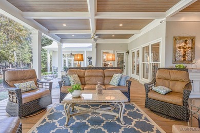 Nestled among mature trees and overlooking Wynlakes Golf Course on Wynlakes Golf and Country Club in Alabama - for sale on GolfHomes.com, golf home, golf lot