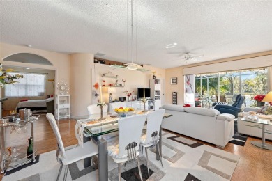 Welcome to this charming 3-bedroom, 2-bathroom WATERFRONT home on East Lake Woodlands Country Club in Florida - for sale on GolfHomes.com, golf home, golf lot