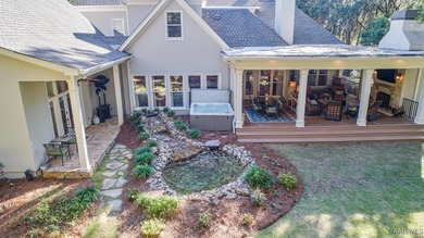 Nestled among mature trees and overlooking Wynlakes Golf Course on Wynlakes Golf and Country Club in Alabama - for sale on GolfHomes.com, golf home, golf lot