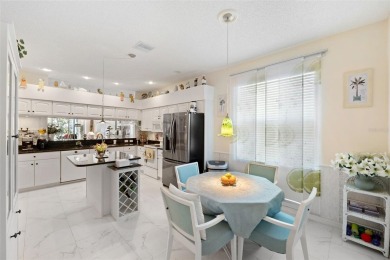 Welcome to this charming 3-bedroom, 2-bathroom WATERFRONT home on East Lake Woodlands Country Club in Florida - for sale on GolfHomes.com, golf home, golf lot