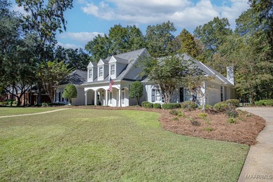 Nestled among mature trees and overlooking Wynlakes Golf Course on Wynlakes Golf and Country Club in Alabama - for sale on GolfHomes.com, golf home, golf lot