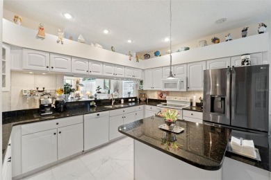 Welcome to this charming 3-bedroom, 2-bathroom WATERFRONT home on East Lake Woodlands Country Club in Florida - for sale on GolfHomes.com, golf home, golf lot