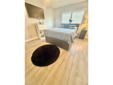 Welcome to this stunning corner unit located on the first floor on LaPlaya Golf Club in Florida - for sale on GolfHomes.com, golf home, golf lot