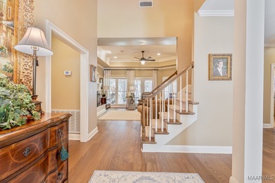 Nestled among mature trees and overlooking Wynlakes Golf Course on Wynlakes Golf and Country Club in Alabama - for sale on GolfHomes.com, golf home, golf lot