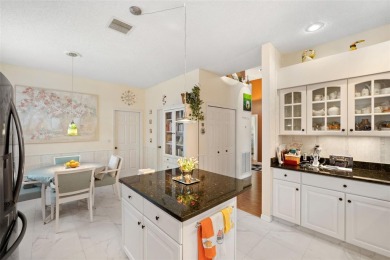 Welcome to this charming 3-bedroom, 2-bathroom WATERFRONT home on East Lake Woodlands Country Club in Florida - for sale on GolfHomes.com, golf home, golf lot