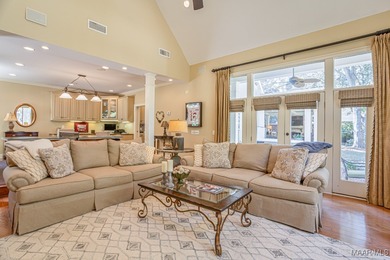 Nestled among mature trees and overlooking Wynlakes Golf Course on Wynlakes Golf and Country Club in Alabama - for sale on GolfHomes.com, golf home, golf lot