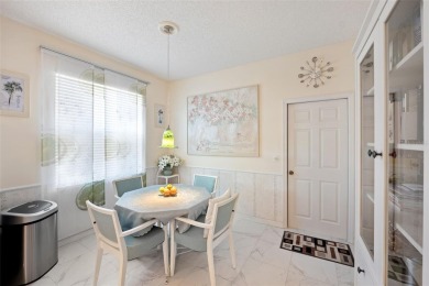 Welcome to this charming 3-bedroom, 2-bathroom WATERFRONT home on East Lake Woodlands Country Club in Florida - for sale on GolfHomes.com, golf home, golf lot